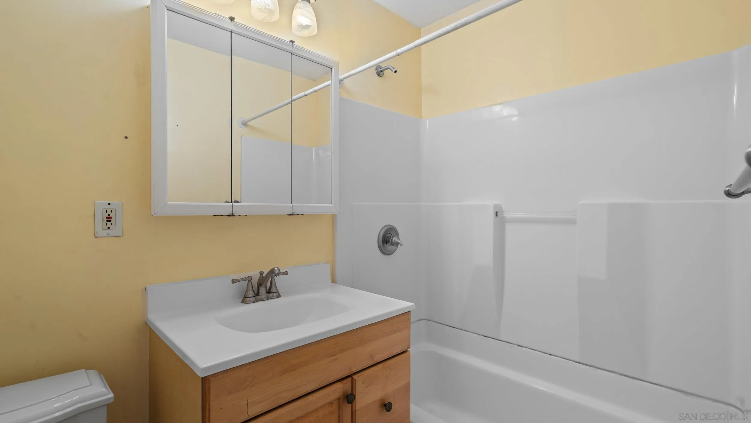 10019 Settle Road Santee, CA 92071 - Photo 28 of 35 a bathroom with a sink a vanity and a shower