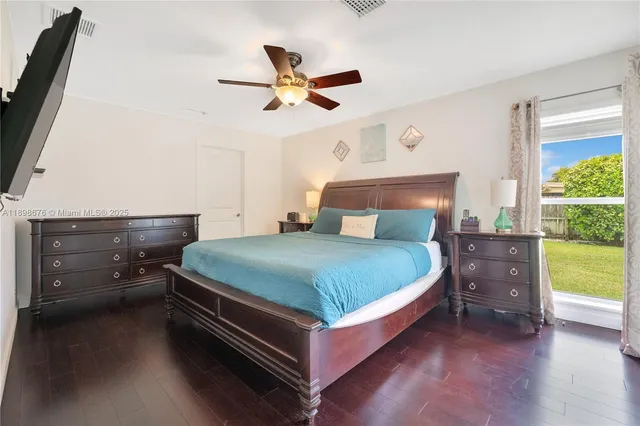 a bedroom with a bed and a table in it