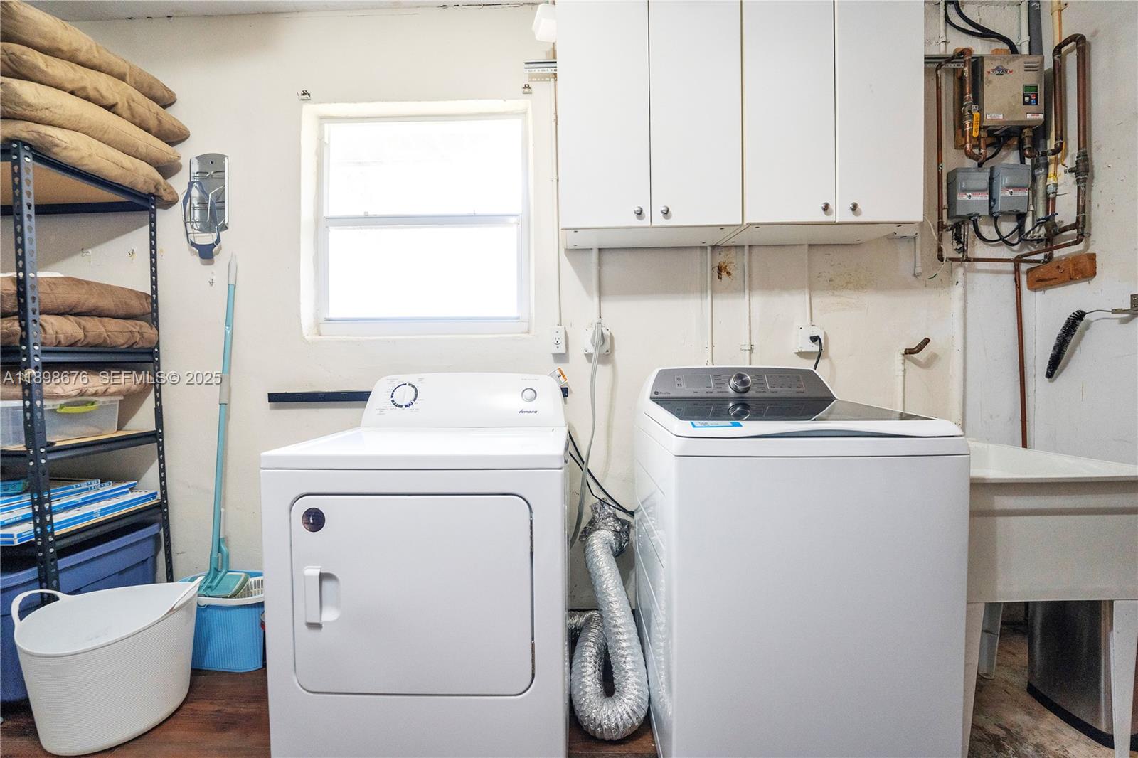 15300 Southwest 164th Street Miami, FL 33187 - Photo 22 of 39 a utility room with dryer and washer