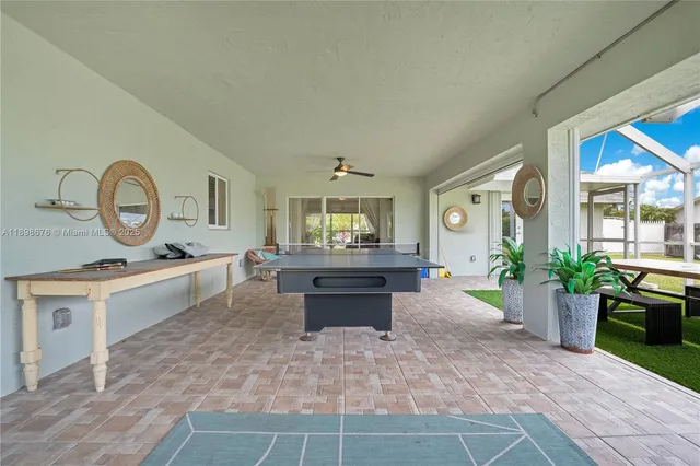 a view of living room kitchen with stove and furniture