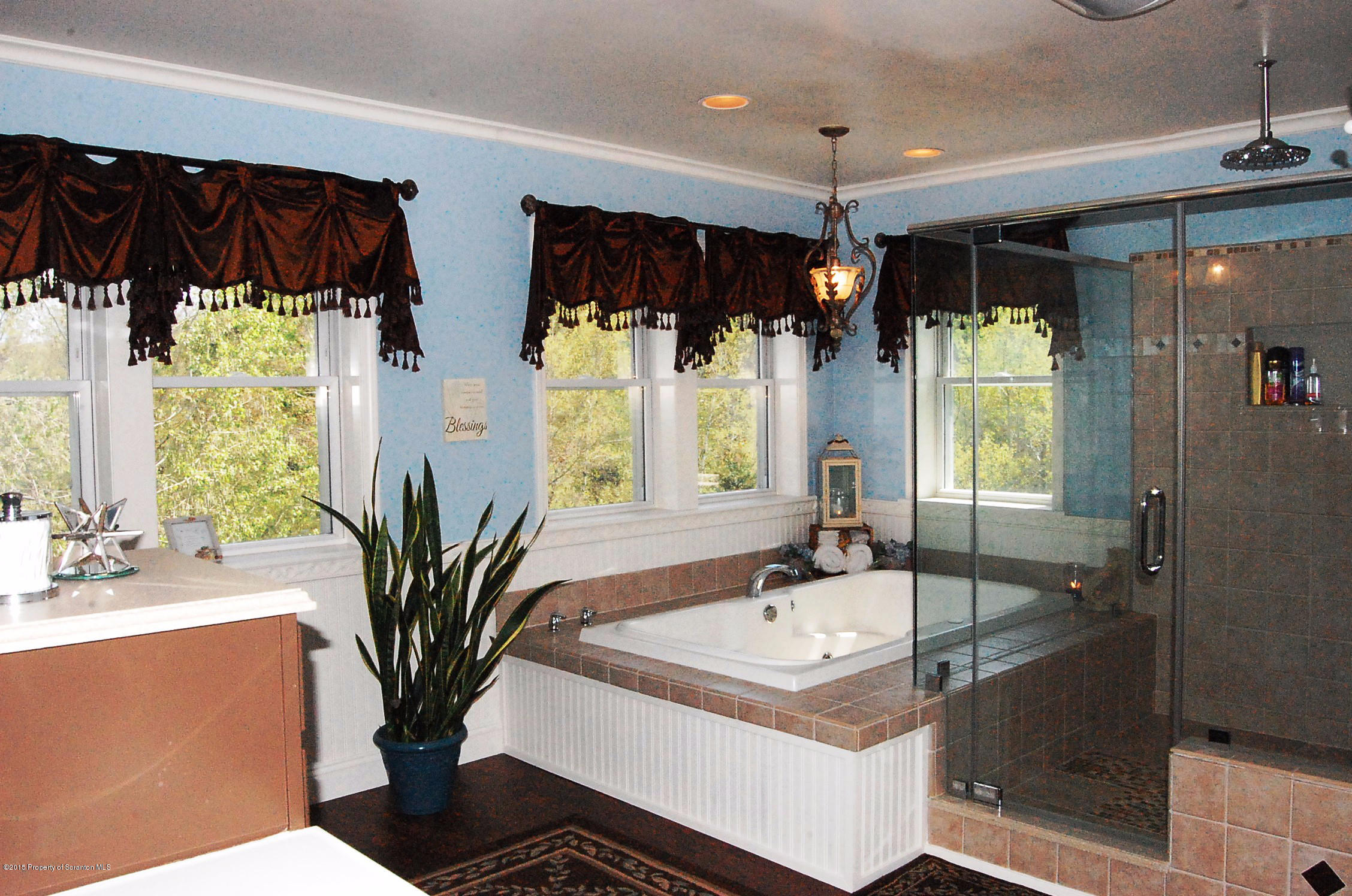 108 Bowens Road Moscow, PA 18444 - Photo 41 of 50 a bathroom with a double vanity sink a mirror and a shower