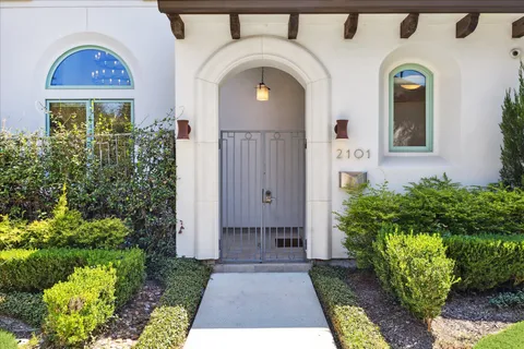 a front view of a house with garden