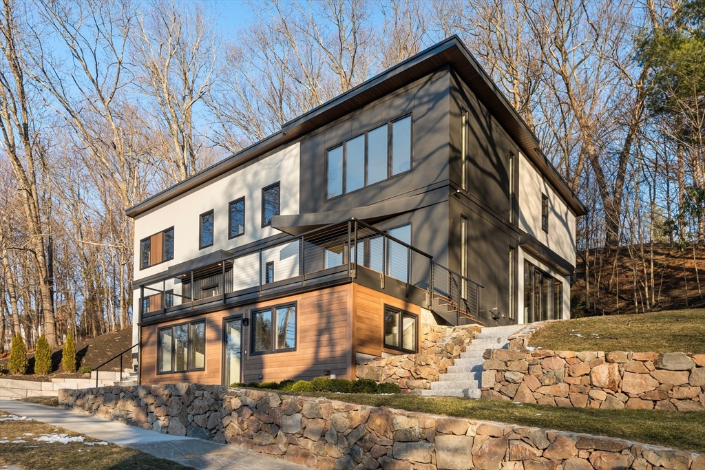 265 Varick Road Newton, MA 02468 - Photo 2 of 32 a view of a building with a yard