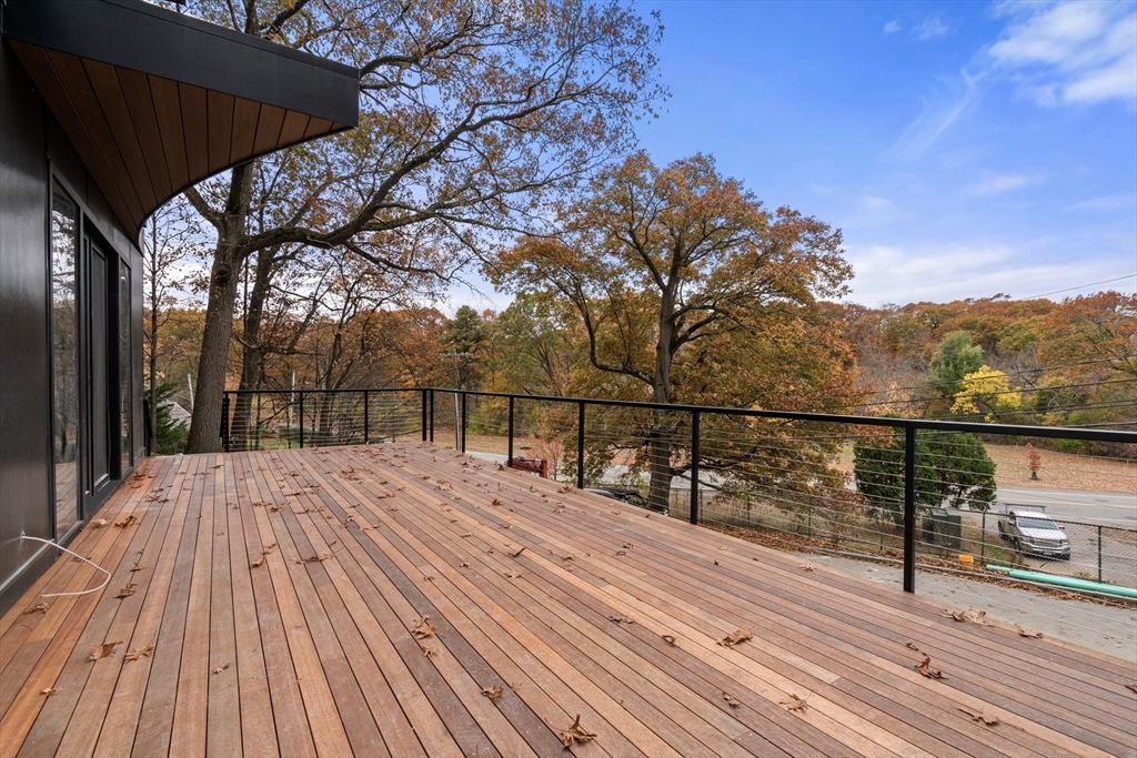 265 Varick Road Newton, MA 02468 - Photo 32 of 32 a view of balcony with wooden floor and fence