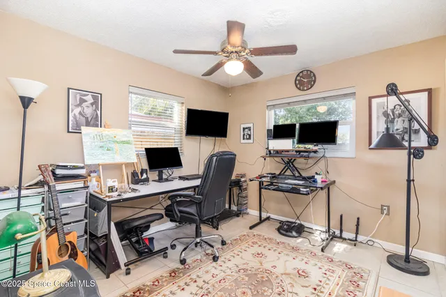 a view of a workspace with a window and a couch