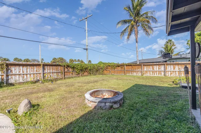 a view of a swimming pool with a yard