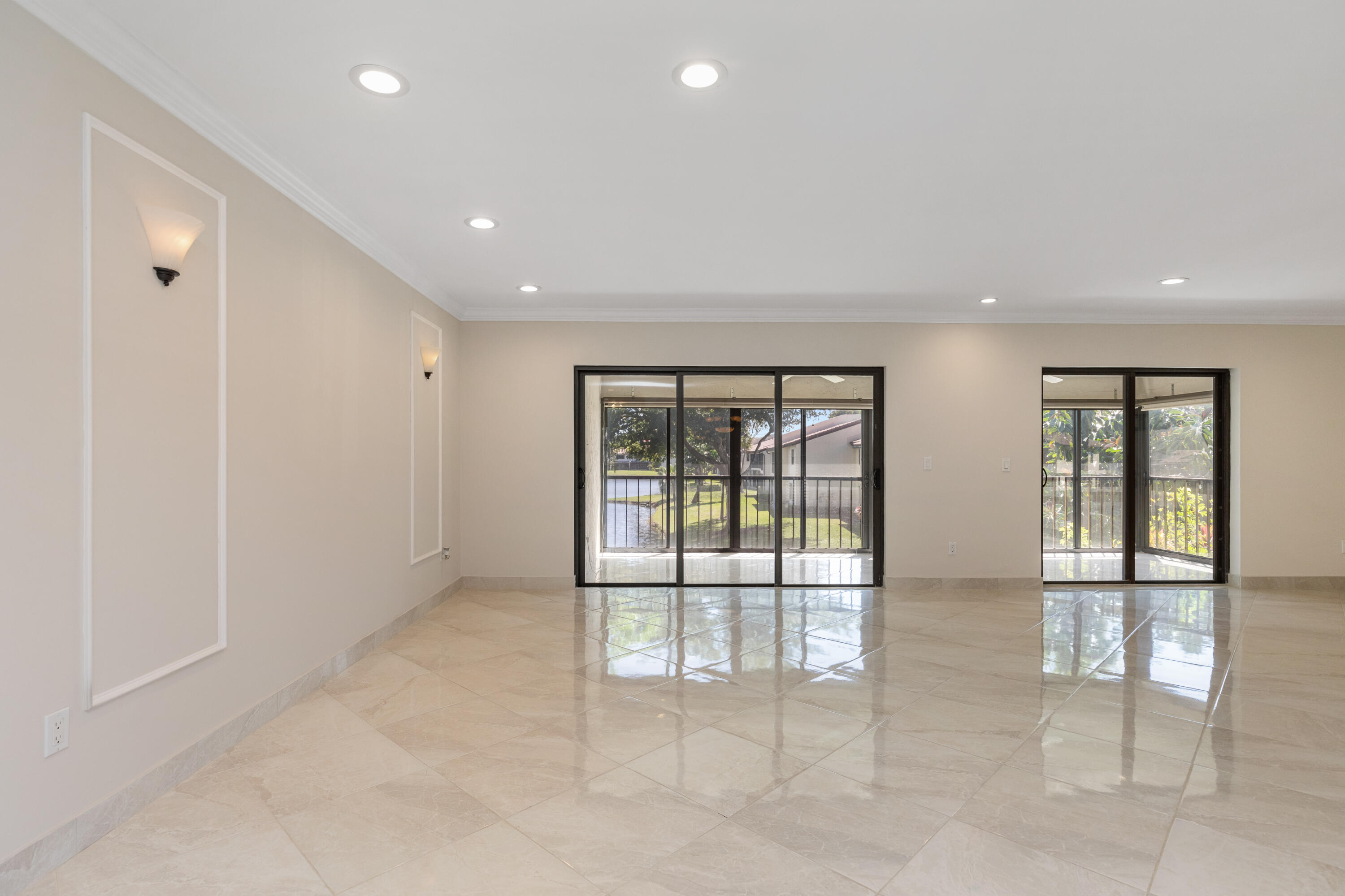 21851 Arriba Real, Unit L Boca Raton, FL 33433 - Photo 5 of 63 LIVING ROOM IMPACT DOORS