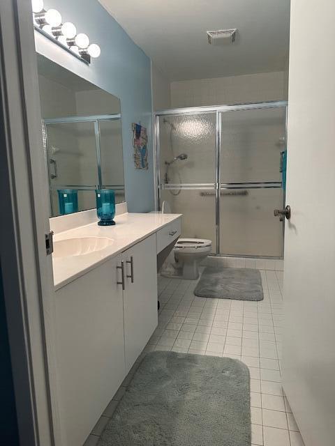 8025 Whispering Palm Drive Boca Raton, FL 33496 - Photo 12 of 27 a bathroom with a sink toilet and shower