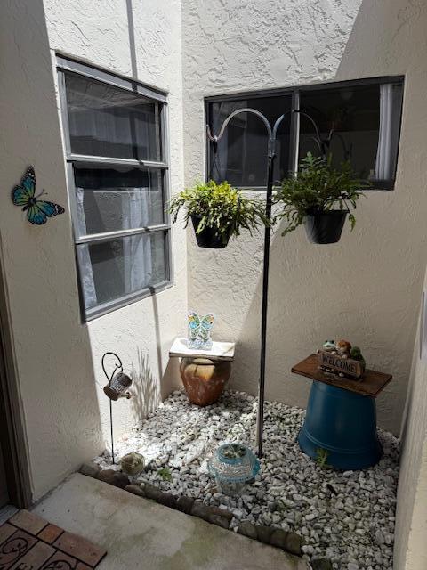 8025 Whispering Palm Drive Boca Raton, FL 33496 - Photo 17 of 27 a table with a vase and flowers on it