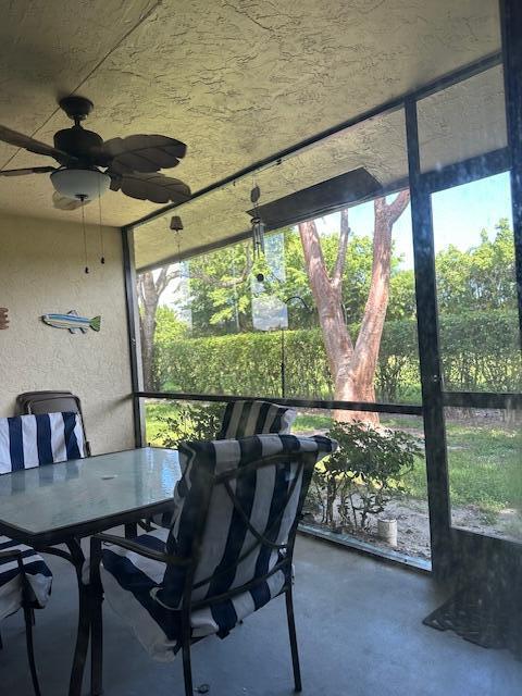 8025 Whispering Palm Drive Boca Raton, FL 33496 - Photo 19 of 27 a dining room with furniture and a floor to ceiling window
