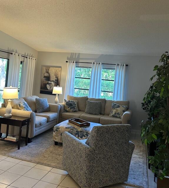 8025 Whispering Palm Drive Boca Raton, FL 33496 - Photo 3 of 27 a living room with furniture and a potted plant