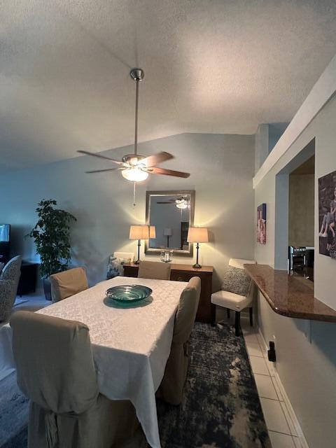 8025 Whispering Palm Drive Boca Raton, FL 33496 - Photo 4 of 27 a dining room with furniture and a chandelier