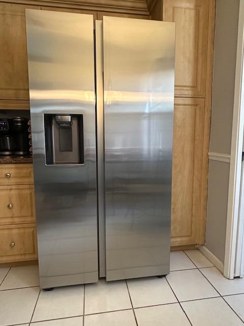 8025 Whispering Palm Drive Boca Raton, FL 33496 - Photo 6 of 27 a view of a refrigerator in kitchen and an empty room with wooden floor