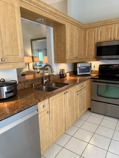 8025 Whispering Palm Drive Boca Raton, FL 33496 - Photo 8 of 27 a kitchen with stainless steel appliances granite countertop a sink dishwasher stove and white cabinets