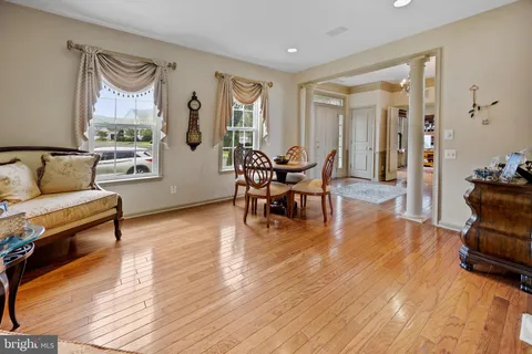a view of a dining room with furniture window and wooden floor