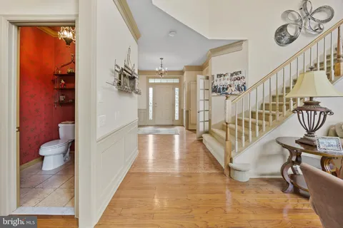 a living room with furniture a fireplace and a large window
