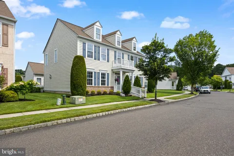 a view of a house with a yard and plants