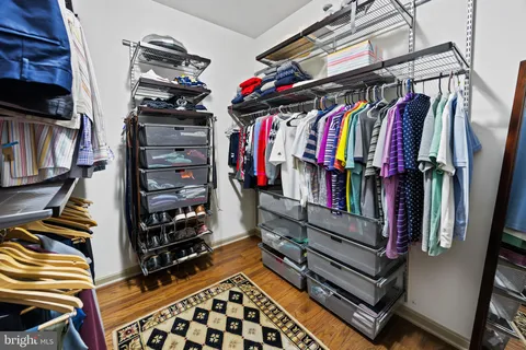 a bathroom with a shower sink and mirror
