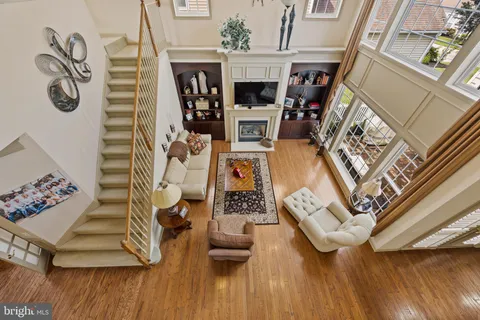 a bedroom with two beds and painting on the wall