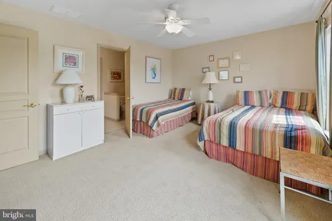 a bathroom with a sink vanity and mirror