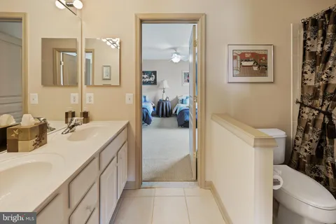 a view of a house with a yard and a garage