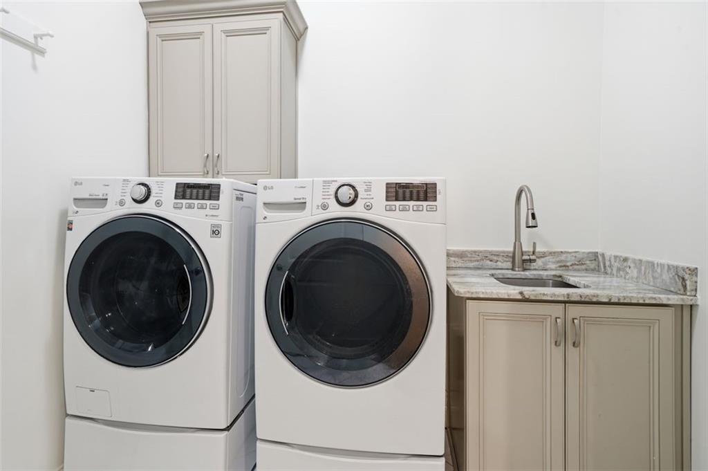 337 Rosshandler Road Suwanee, GA 30024 - Photo 27 of 45 a utility room with dryer and washer