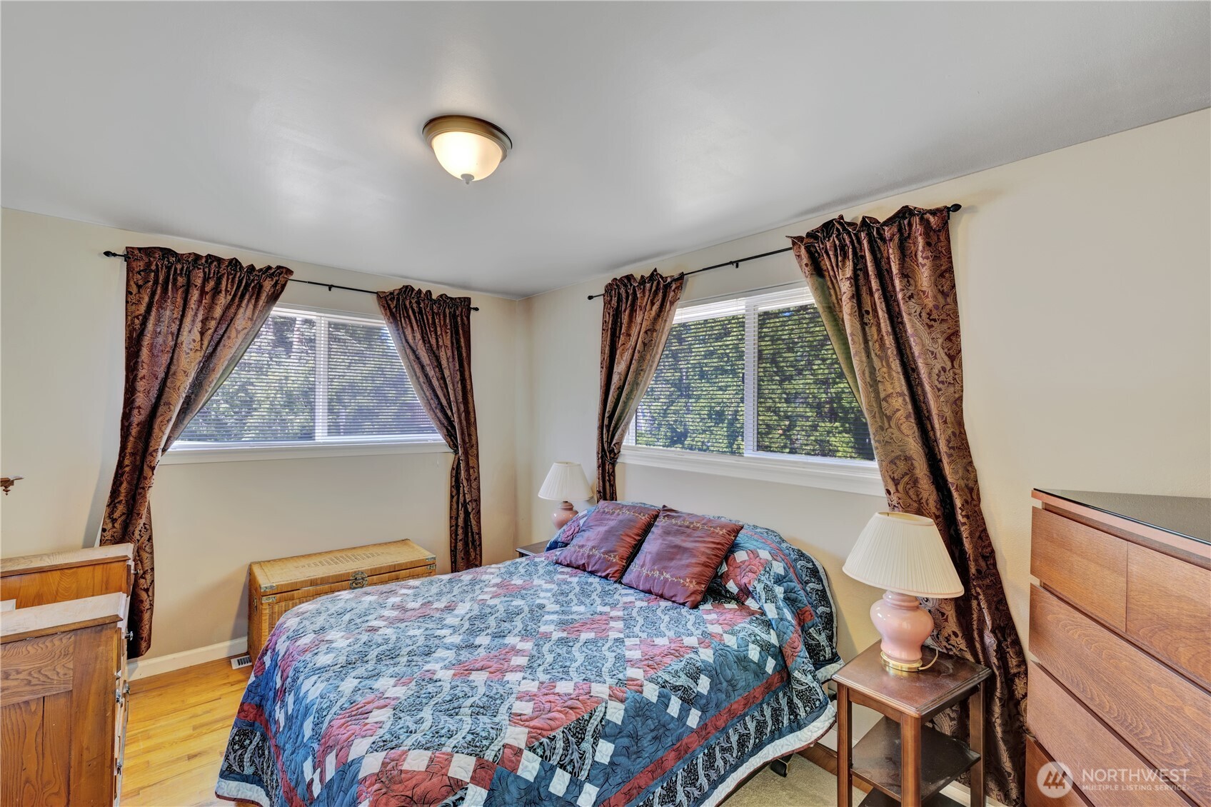 10208 28th Avenue Southwest Seattle, WA 98146 - Photo 11 of 17 a bedroom with a bed and a window