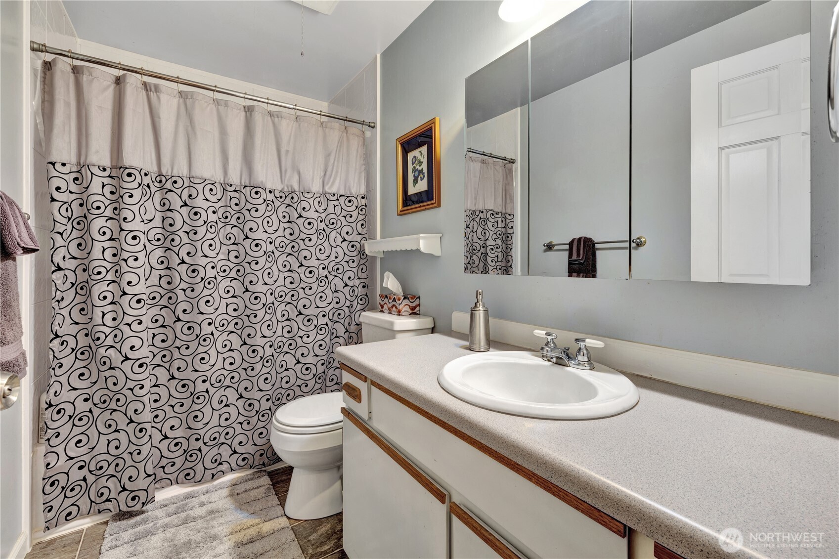 10208 28th Avenue Southwest Seattle, WA 98146 - Photo 13 of 17 a bathroom with a sink toilet and shower