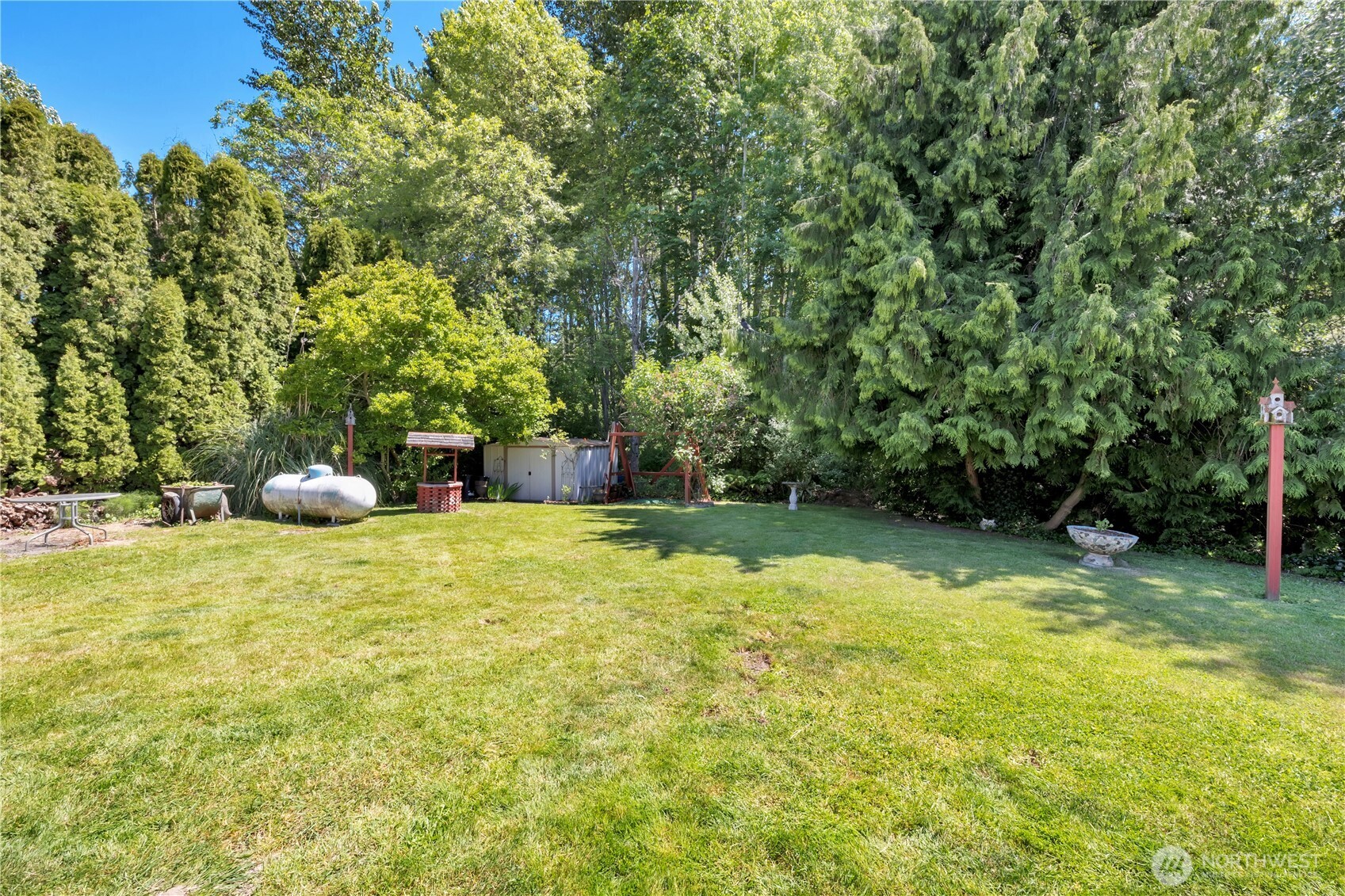 10208 28th Avenue Southwest Seattle, WA 98146 - Photo 16 of 17 a house with trees in front of it