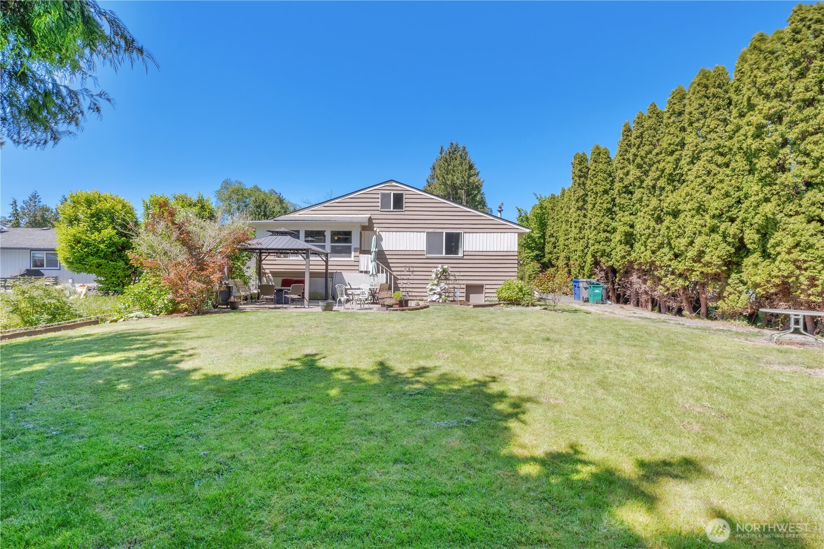10208 28th Avenue Southwest Seattle, WA 98146 - Photo 17 of 17 a front view of a house with a big yard