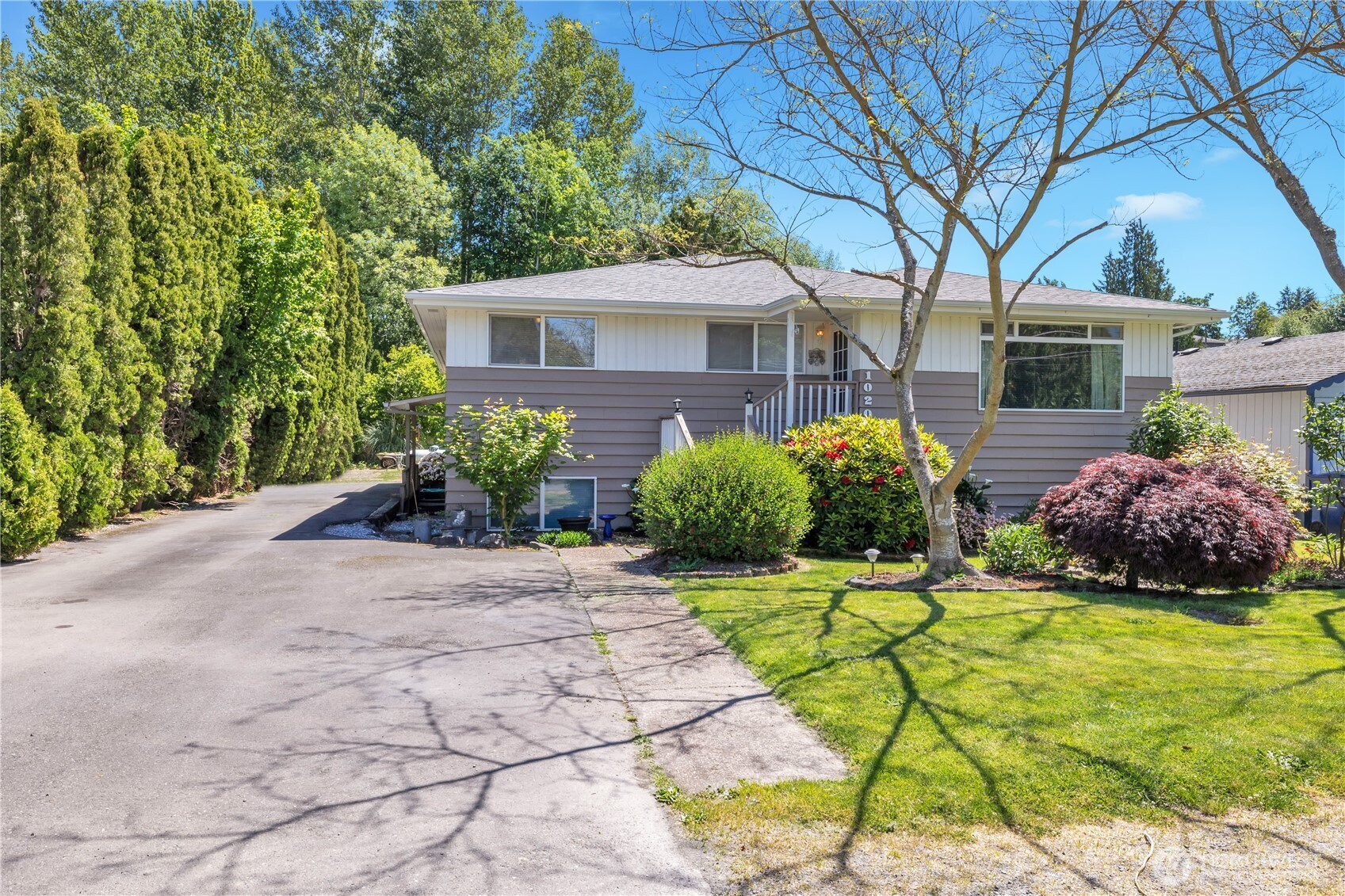 10208 28th Avenue Southwest Seattle, WA 98146 - Photo 2 of 17 a front view of a house with garden