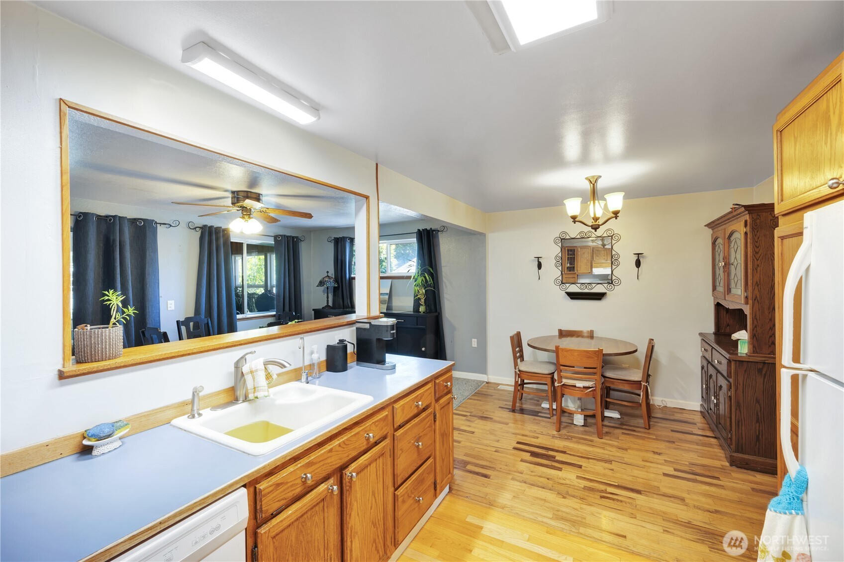 10208 28th Avenue Southwest Seattle, WA 98146 - Photo 5 of 17 a kitchen with stainless steel appliances granite countertop sink and refrigerator