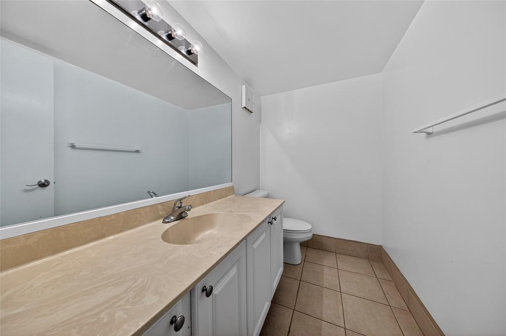 711 North Pine Island Road, Unit 319 Plantation, FL 33324 - Photo 17 of 27 a bathroom with a sink and a mirror