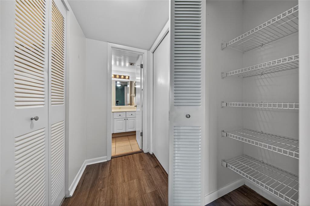 711 North Pine Island Road, Unit 319 Plantation, FL 33324 - Photo 20 of 27 a view of a hallway with wooden floor and staircase