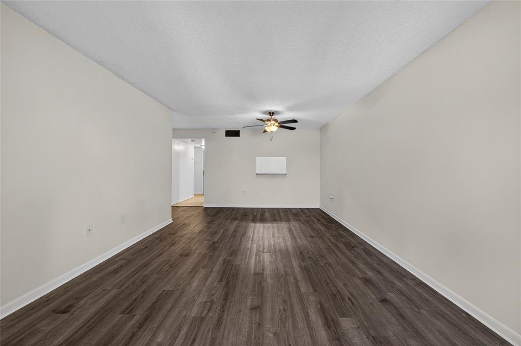 711 North Pine Island Road, Unit 319 Plantation, FL 33324 - Photo 2 of 27 wooden floor in an empty room