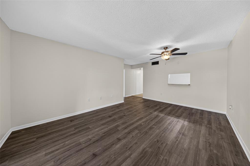 711 North Pine Island Road, Unit 319 Plantation, FL 33324 - Photo 3 of 27 a view of empty room with wooden floor