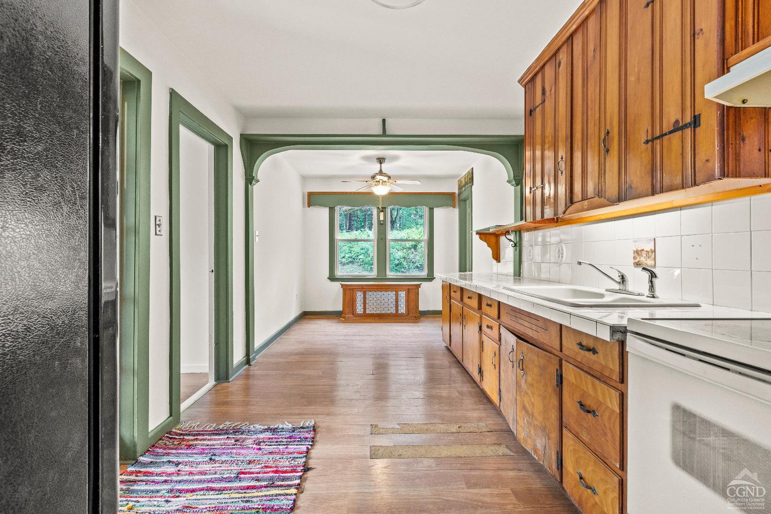 Eat in kitchen with original cabinets.