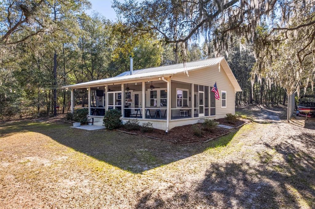 1412 Baden Powell Road Hawthorne, FL 32640 - Photo 2 of 48 a view of a house with a yard