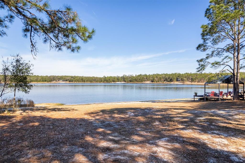 1412 Baden Powell Road Hawthorne, FL 32640 - Photo 3 of 48 a view of a lake with houses in the background