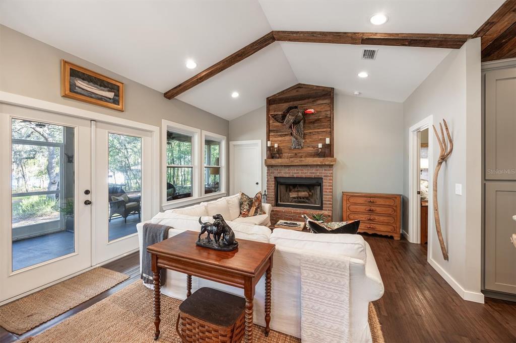 1412 Baden Powell Road Hawthorne, FL 32640 - Photo 7 of 48 a view of a livingroom with furniture and a fireplace