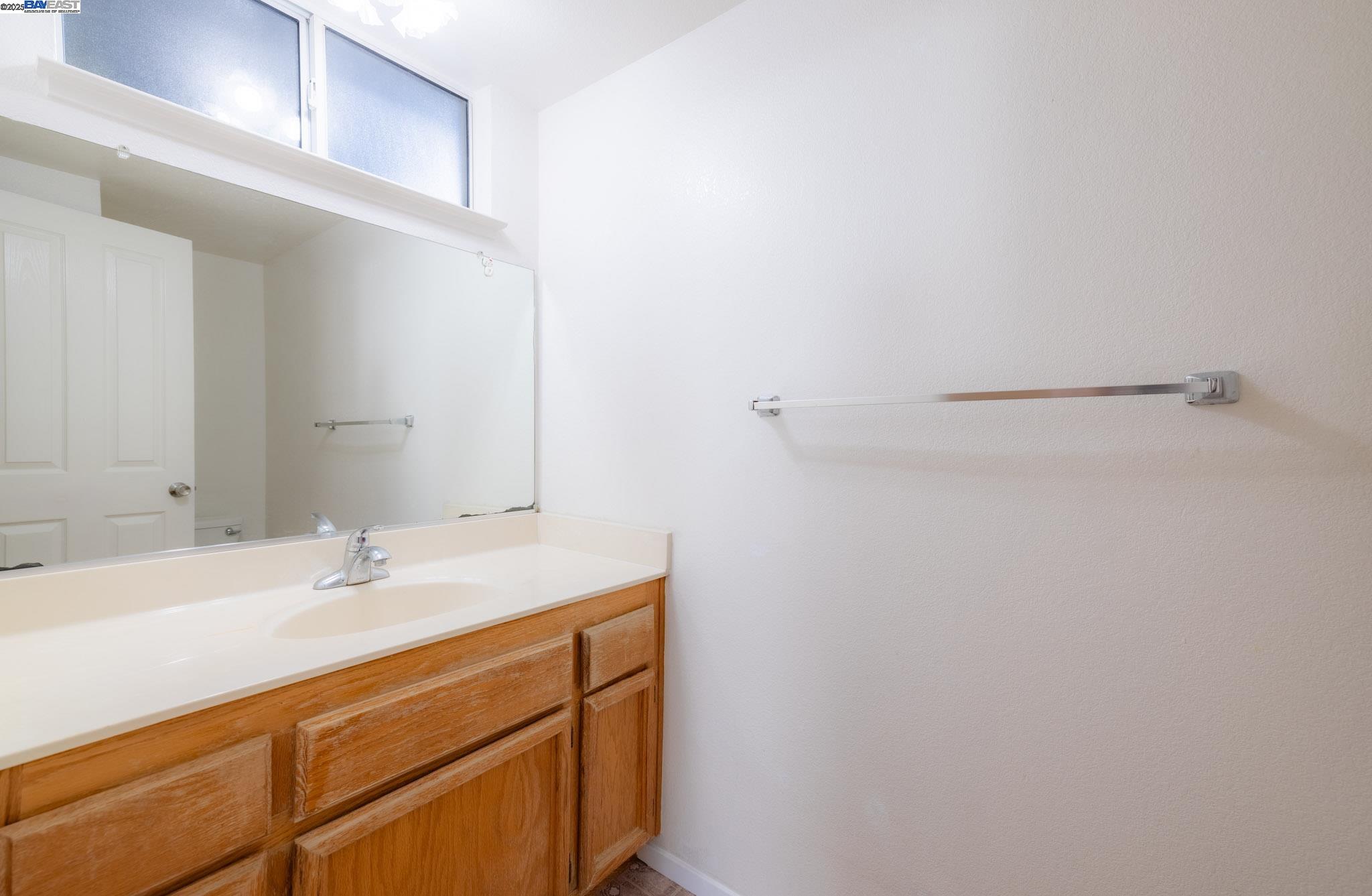 123 Pelican Loop Pittsburg, CA 94565 - Photo 16 of 60 a bathroom with a sink and a mirror