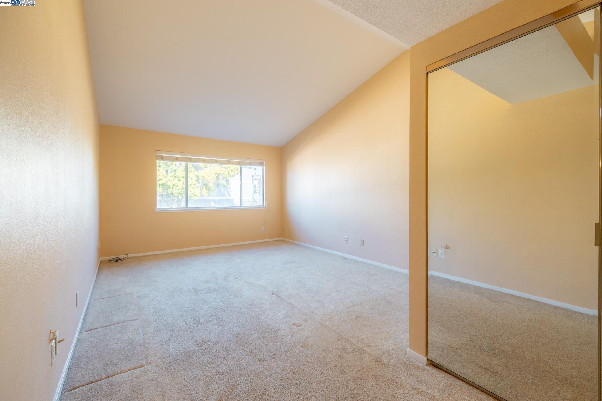 123 Pelican Loop Pittsburg, CA 94565 - Photo 23 of 60 an empty room with windows