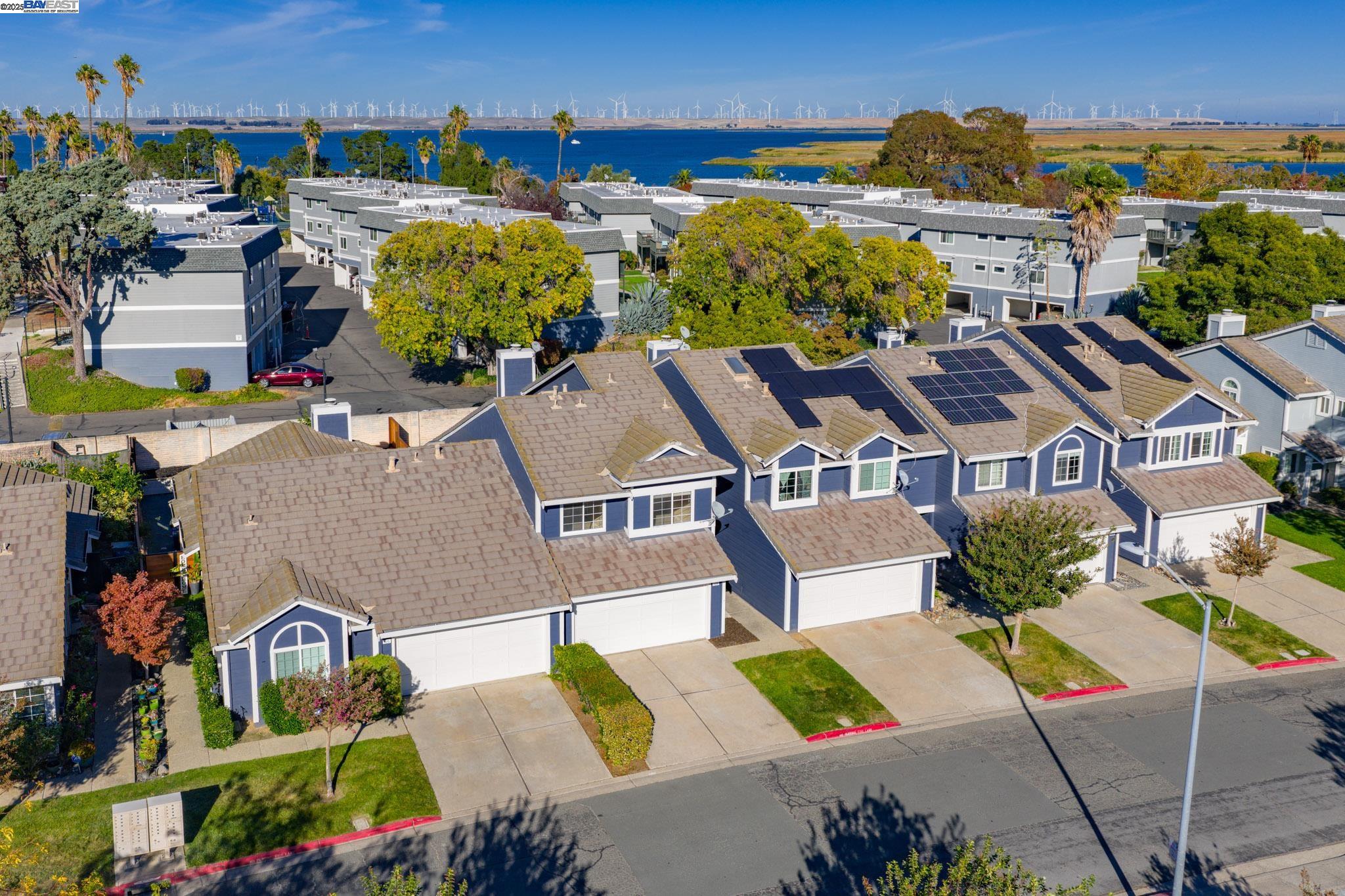 123 Pelican Loop Pittsburg, CA 94565 - Photo 45 of 60 an aerial view of multiple houses with a yard
