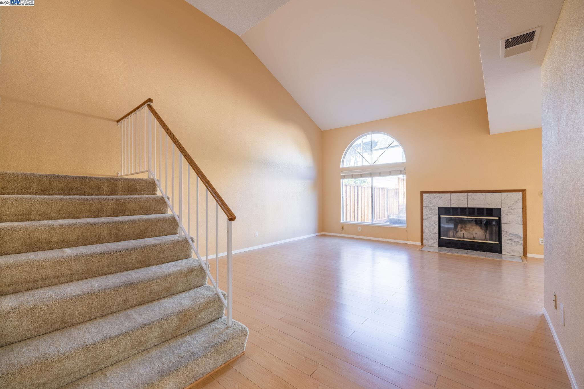 123 Pelican Loop Pittsburg, CA 94565 - Photo 7 of 60 a view of an entryway with wooden floor and a window