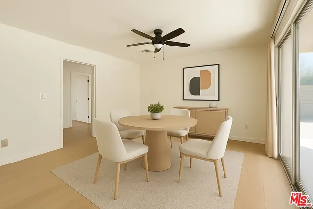 a view of a dining room with furniture and window