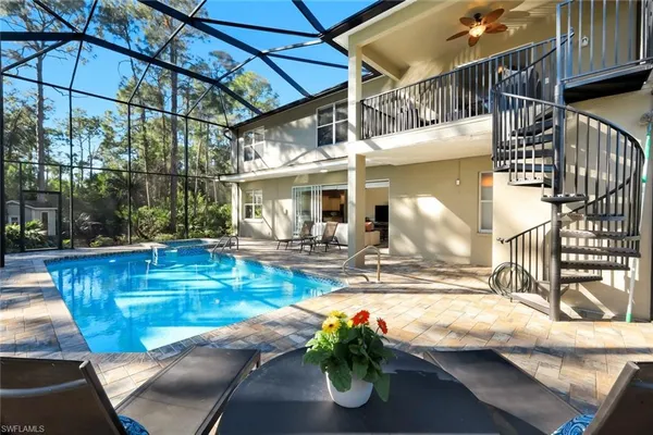 a view of a swimming pool with a patio