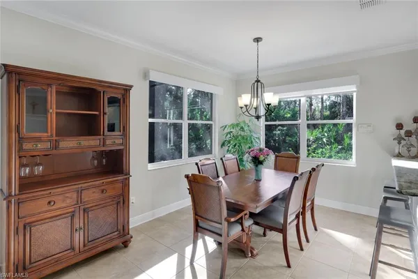 a dining room with furniture window wooden floor