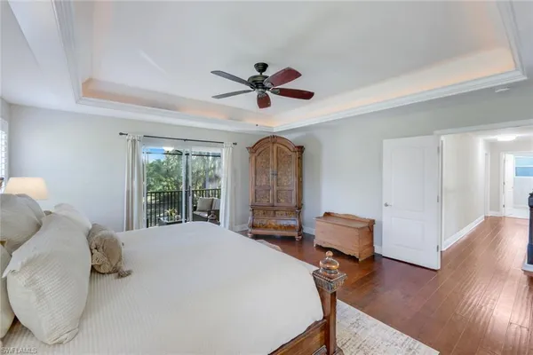 a bed room with a bed and a chair