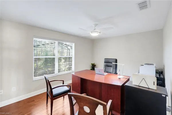 a dining room with furniture and window