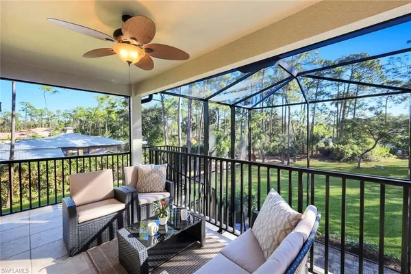 a view of a balcony with furniture